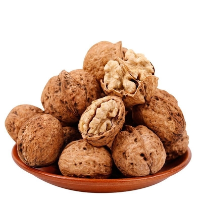 comprar Al por mayor de China Nueces de Yunnan con núcleos oscuros Precios crudos en cáscara Nueces secas online manufacture